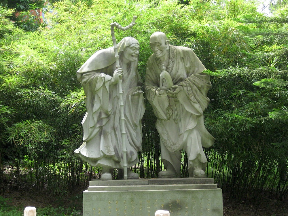 A stone statue of arhats on the temple grounds