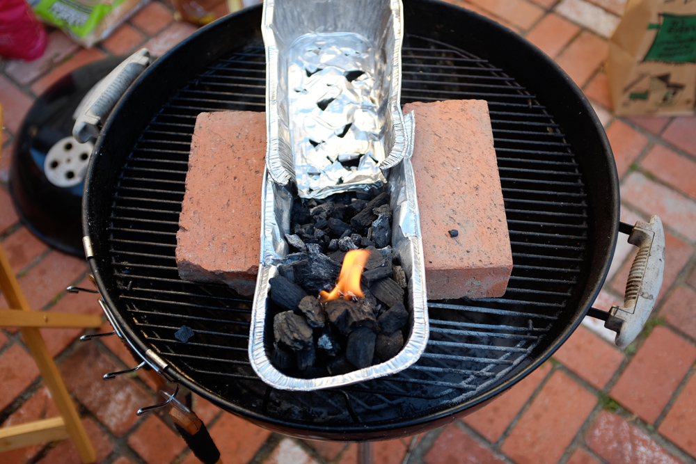 Preparing the coals in a makeshift shao kao grill